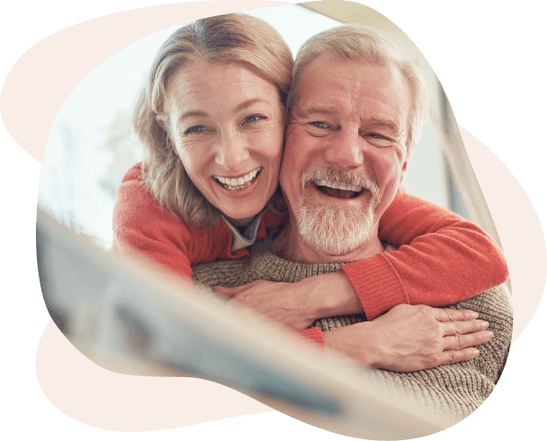 Happy senior couple looking at photos